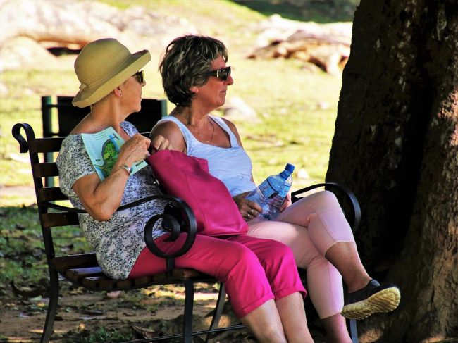 two elderly women on a bench