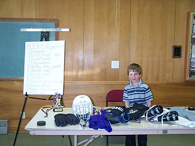 Boy demonstrating Hockey gear
