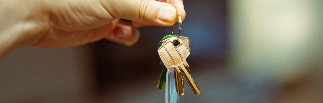hand holding house keys